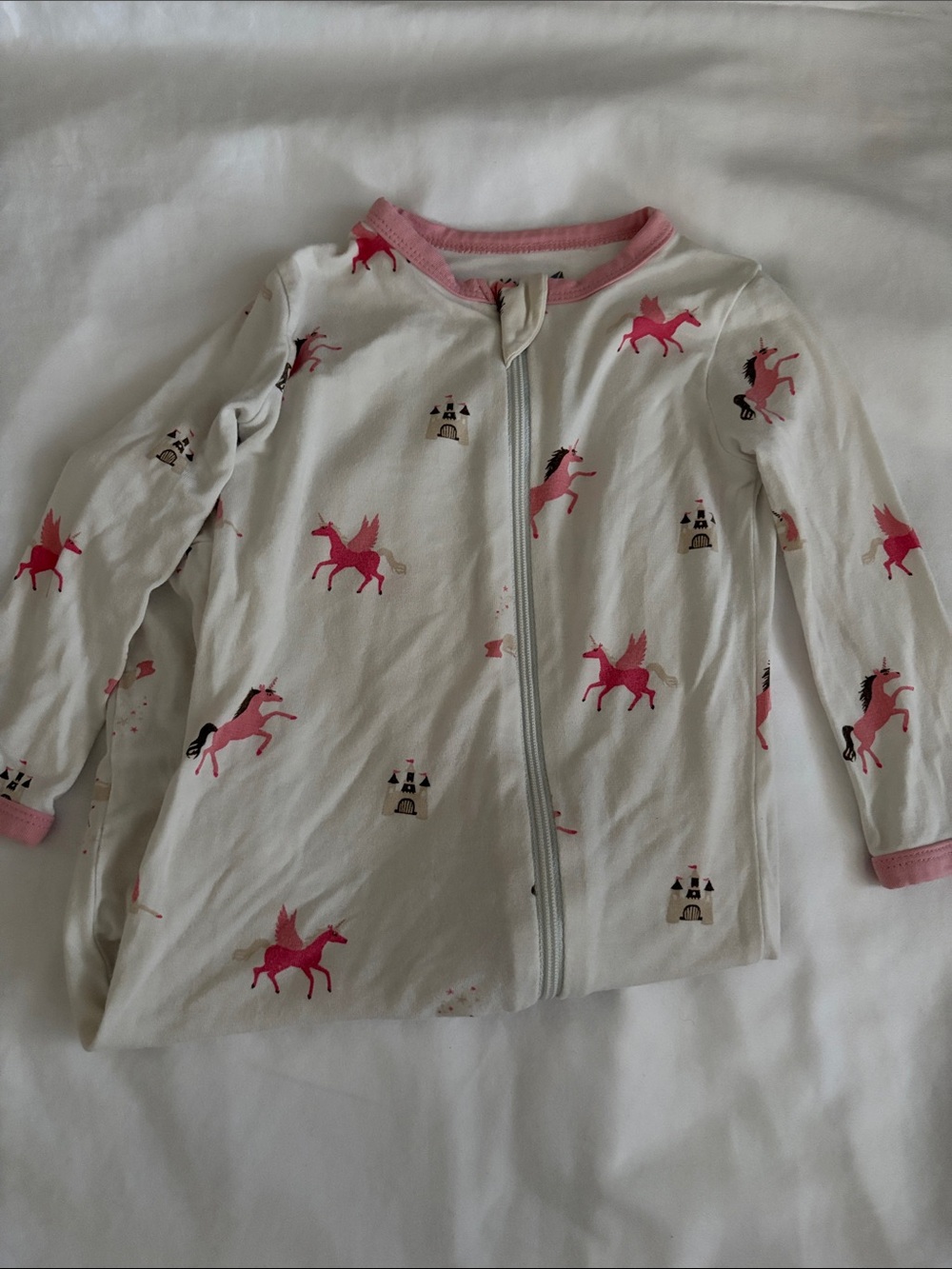 Kyte Baby pink and white unicorn castle print zippy